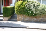 This low wall and flowering shrubs strikes the right note